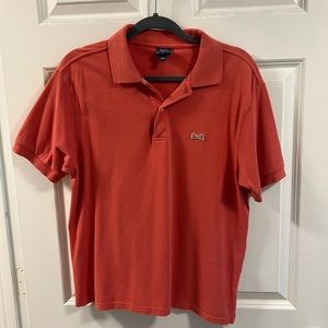 Le Tigre orange polo.